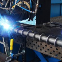 Automated laser process employed for welding rotary parts